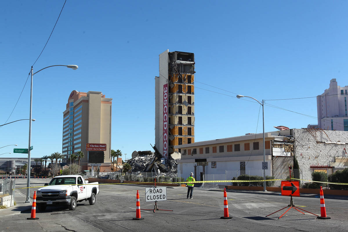 Crews prepare to topple the remaining portion of The Clarion after an early-morning implosion f ...