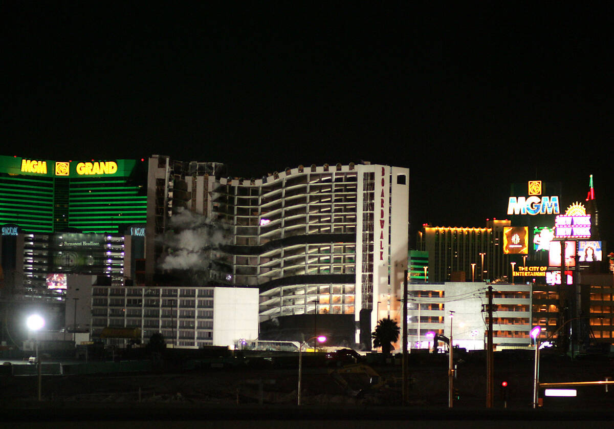 The Boardwalk hotel-casino begins to collapse in on itself as it is imploded May 9, 2006. (Revi ...
