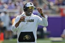 Colorado head coach Deion Sanders yells from the sidelines during the first half of an NCAA col ...