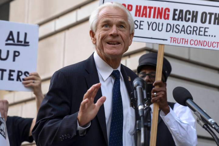 Former White House trade adviser Peter Navarro speaks to the media as he departs federal court, ...