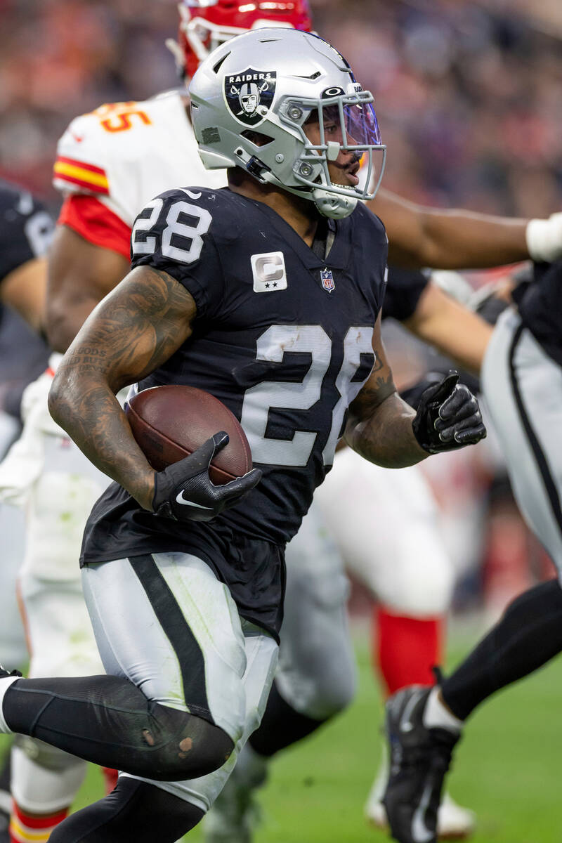 Las Vegas Raiders running back Josh Jacobs (28) runs the ball against the Kansas City Chiefs in ...