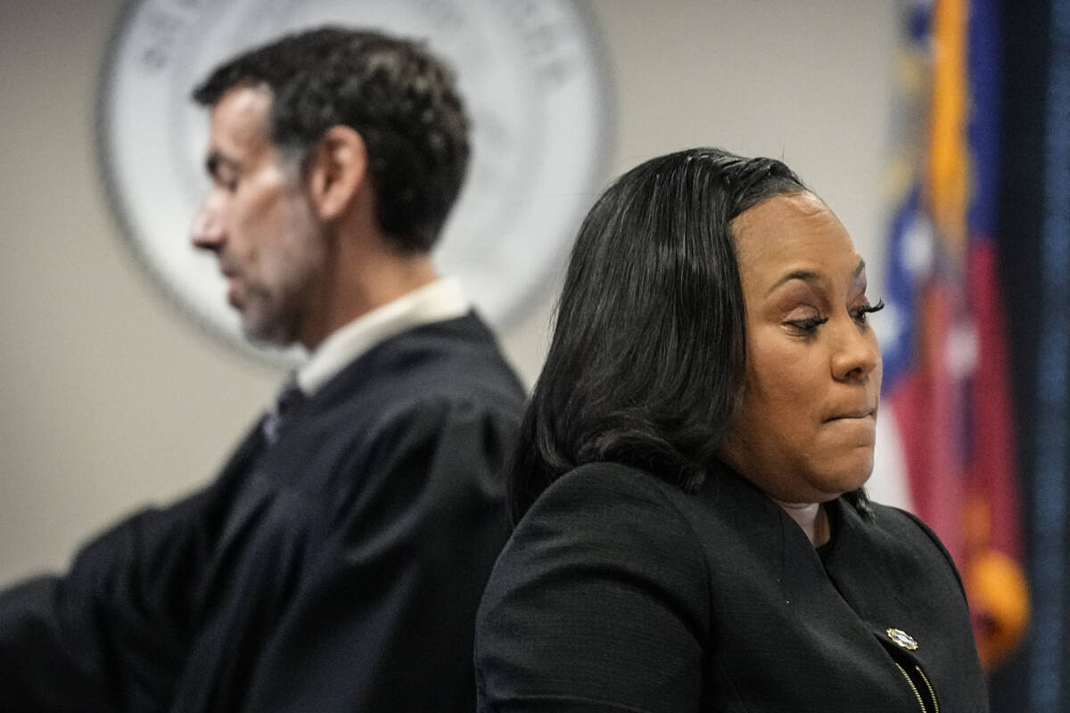 FILE - Fulton County District Attorney Fani Willis, right, and Fulton County Superior Court Jud ...