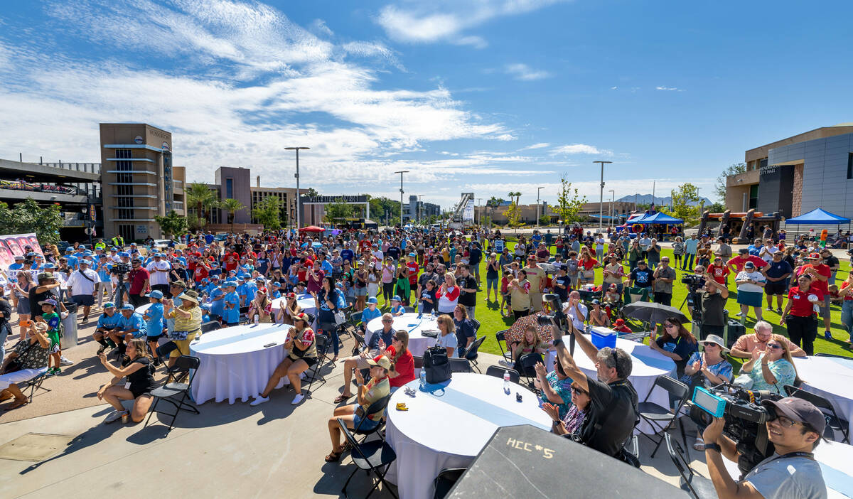 Fans applaud the Henderson Little League team and coaches on stage during a celebration at City ...