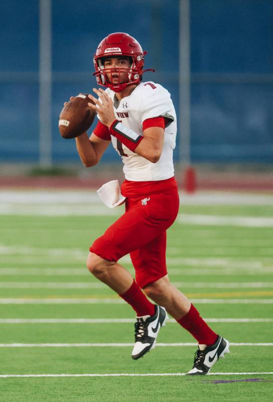 Arbor View quarterback Thaddeus Thatcher (7) looks to throw the ball to a teammate during a gam ...