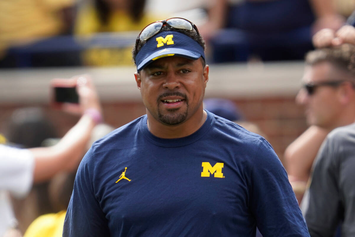 Michigan run game coordinator Mike Hart watches before an NCAA college football game against UN ...