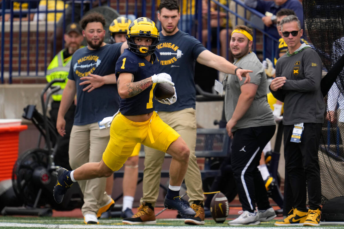 Michigan wide receiver Roman Wilson (1) runs after a catch on a 47-yard touchdown against UNLV ...