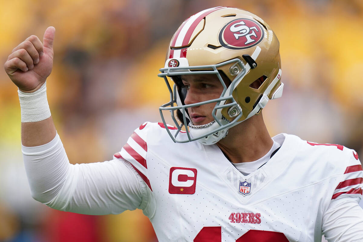 San Francisco 49ers quarterback Brock Purdy warms up before an NFL football game against the Pi ...