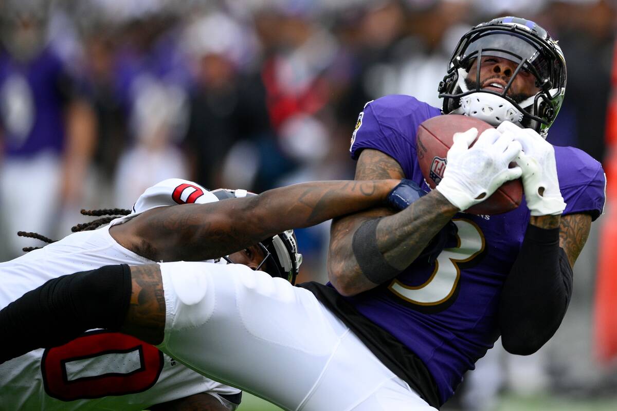 Baltimore Ravens' Odell Beckham Jr. catches a pass in front of Houston Texans' Shaquill Griffin ...