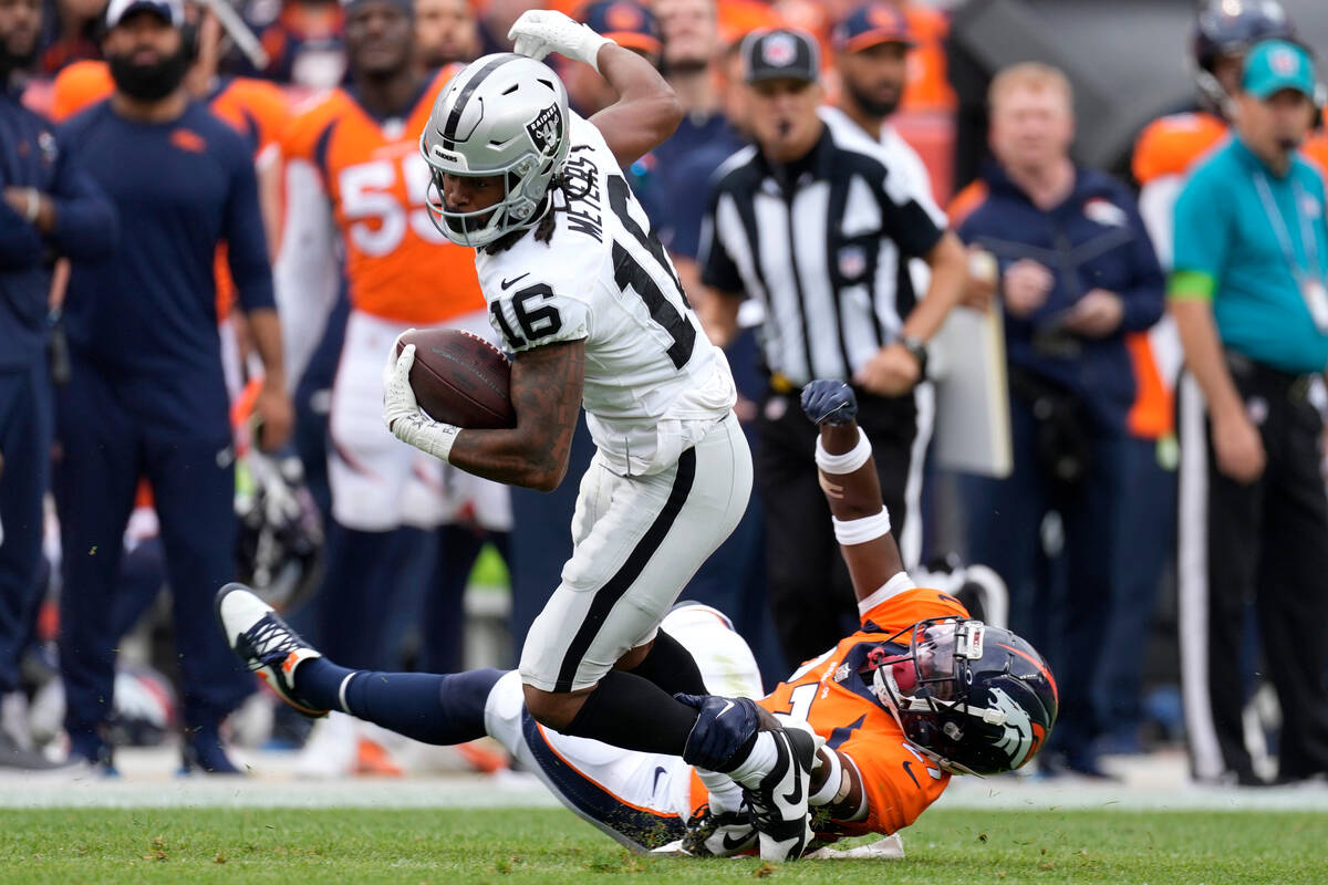 Las Vegas Raiders wide receiver Jakobi Meyers (16) breaks away from Denver Broncos cornerback D ...