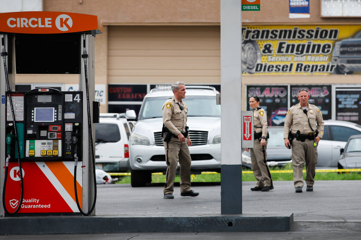 Police respond to a shooting at a Circle K on the corner of Fremont Street and St. Louis Street ...