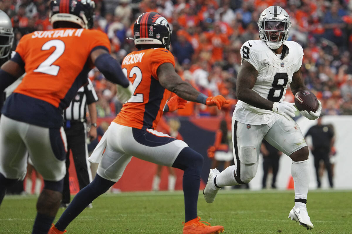 Las Vegas Raiders running back Josh Jacobs (8) runs the ball against the Denver Broncos of an N ...