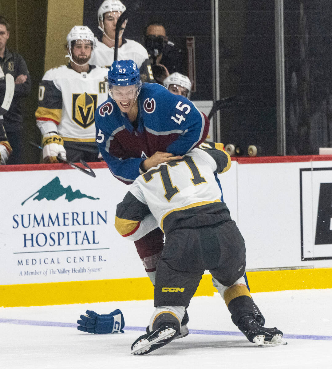 Golden Knights prospect forward Ty Cheveldayoff is pined down by Colorado Avalanche Milo Rollen ...