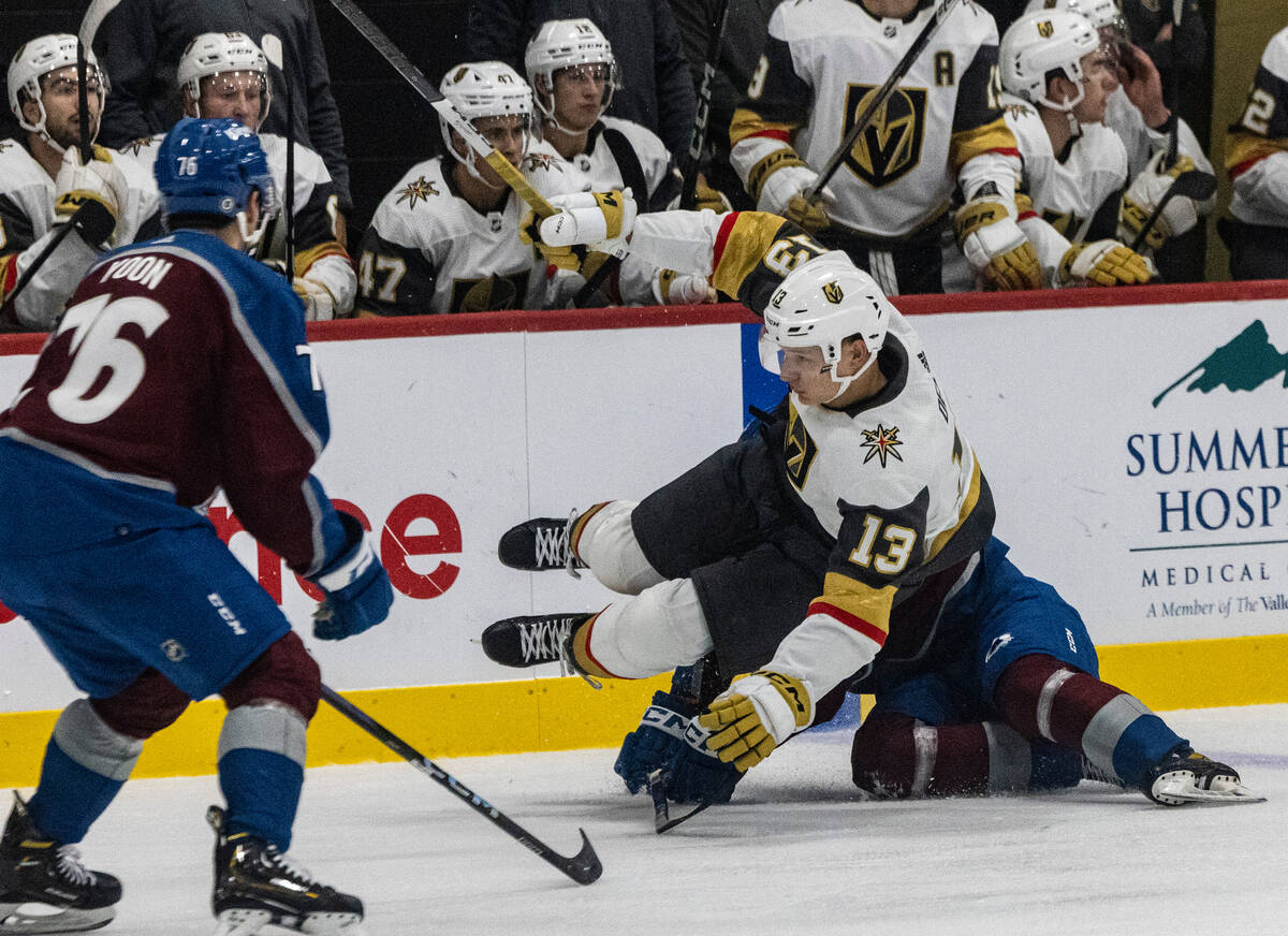 Golden Knights prospect forward Jakub Derek (13) loses his balance as he was chased by Colorado ...