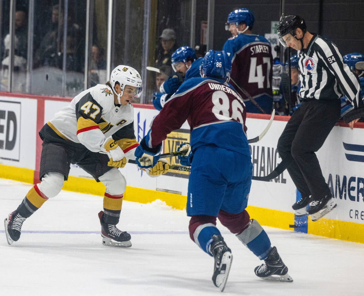 Golden Knights prospect forward Patrick Guay (47) and Colorado Avalanche Michael Underwood (89) ...