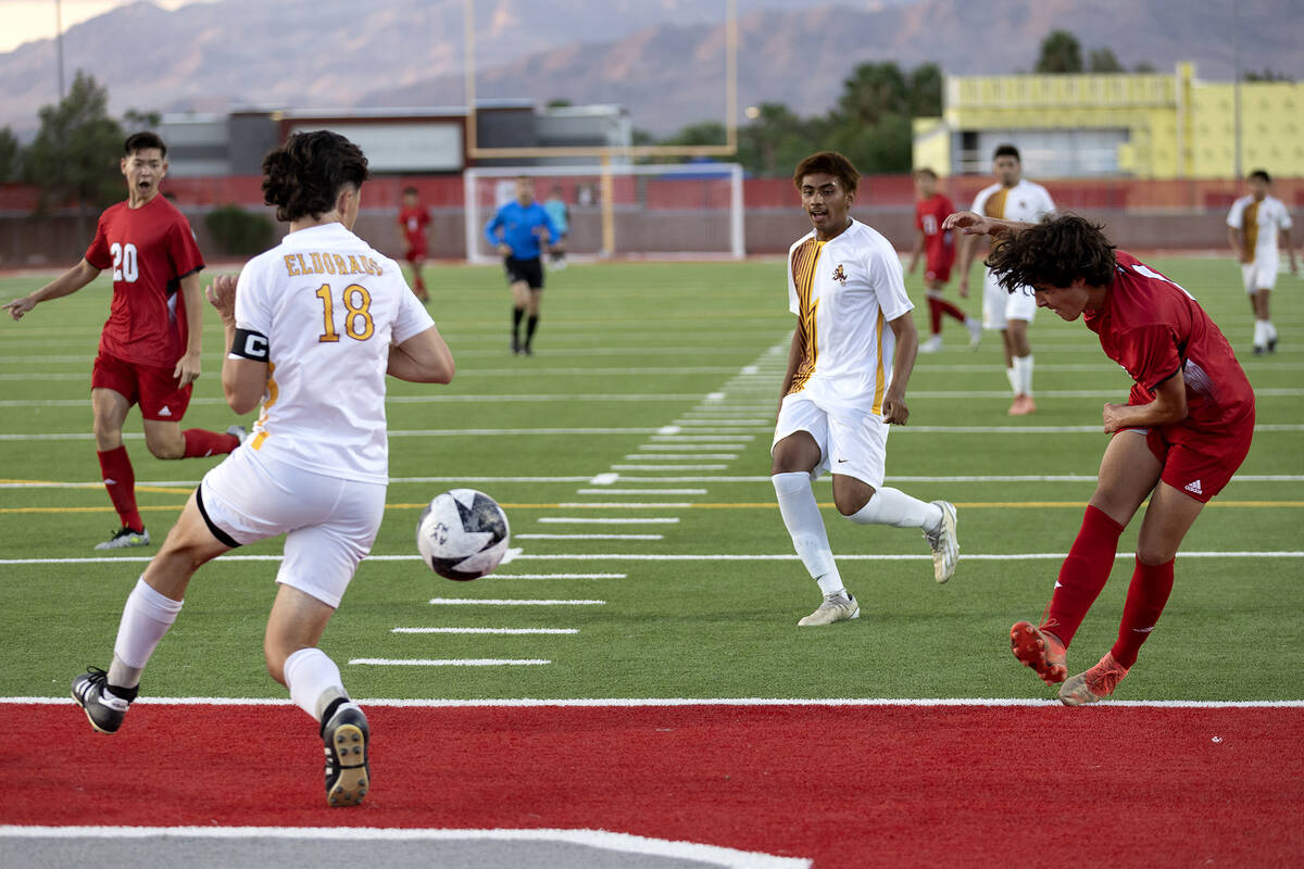 Arbor View's Bryce Rocha (7) kicks an attempted goal past Eldorado defender Luke Ostler (18) du ...