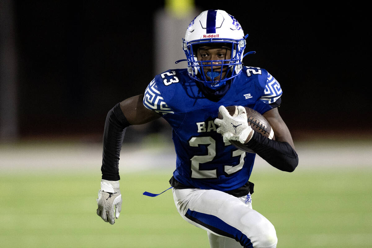 Basic wide receiver Zuri Whiters (23) runs the ball during the second half of a high school foo ...