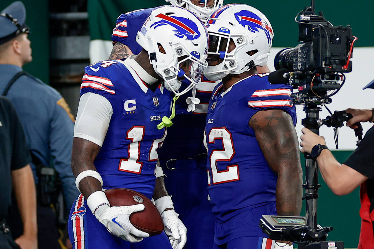 Buffalo Bills wide receiver Stefon Diggs (14) celebrates with Buffalo Bills running back Damien ...