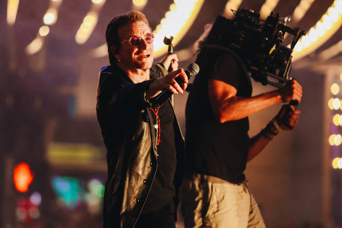 U2 performs while filming a music video in front of the Plaza hotel and casino on Sunday, Sept. ...