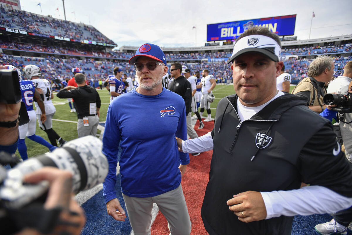 Buffalo Bills' head coach Sean McDermott, left, talks to Las Vegas Raiders' head coach Josh McD ...