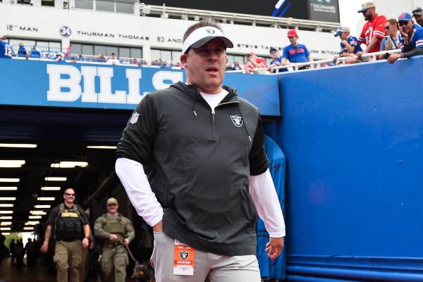Las Vegas Raiders' head coach Josh McDaniels walks toward the field before an NFL football game ...