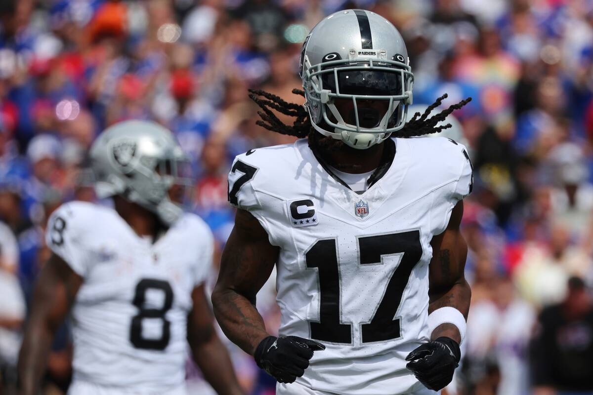 Las Vegas Raiders' Davante Adams (17) runs on the field during the first half of an NFL footbal ...