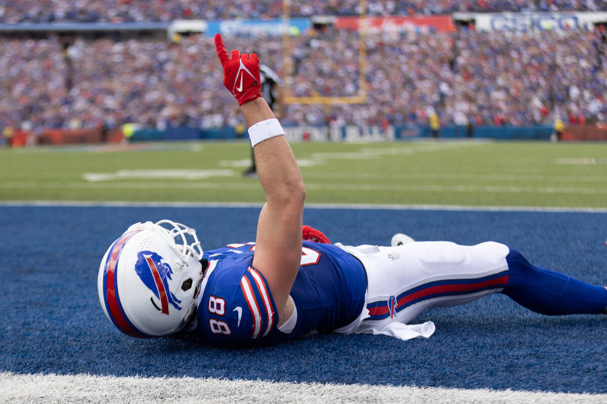 Buffalo Bills tight end Dawson Knox (88) scores a touchdown during the first half of an NFL gam ...