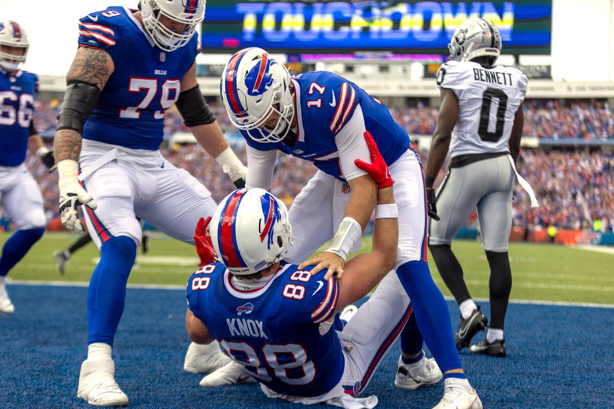 Buffalo Bills quarterback Josh Allen (17) congratulates tight end Dawson Knox (88) on his touch ...