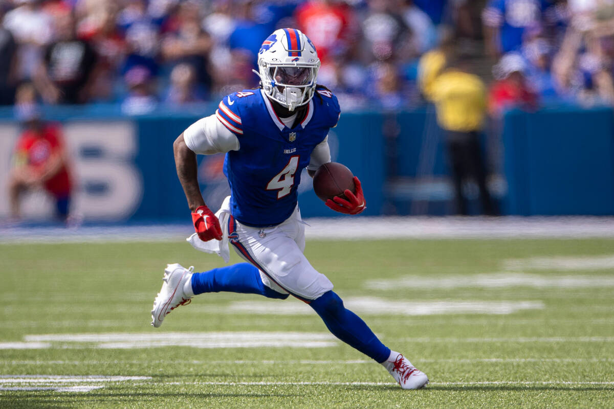 Buffalo Bills running back James Cook (4) runs in open field during the first half of an NFL ga ...