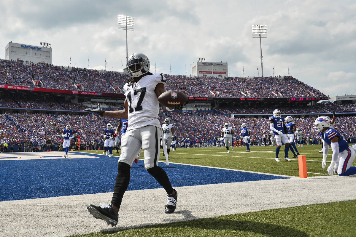 Las Vegas Raiders' Davante Adams (17) celebrates after scoring a touchdown during the first hal ...