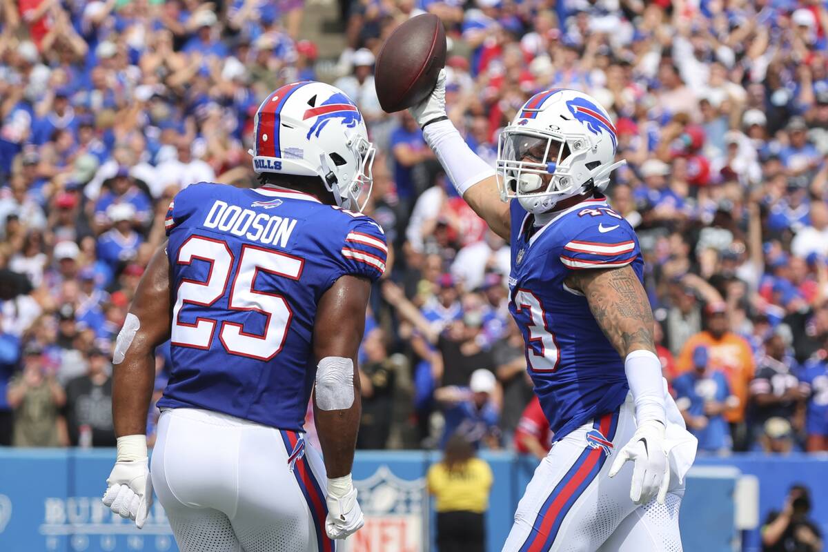 Buffalo Bills linebacker Terrel Bernard (43) celebrates an interception with teammate Tyrel Dod ...