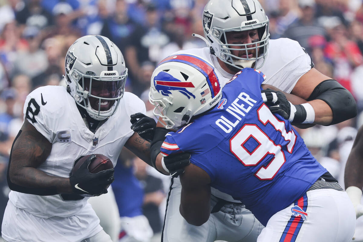 Buffalo Bills defensive tackle Ed Oliver (91) fights past Las Vegas Raiders' Greg Van Roten (70 ...