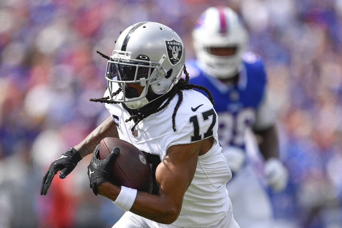 Las Vegas Raiders wide receiver Davante Adams (17) runs for a touchdown during the first half o ...