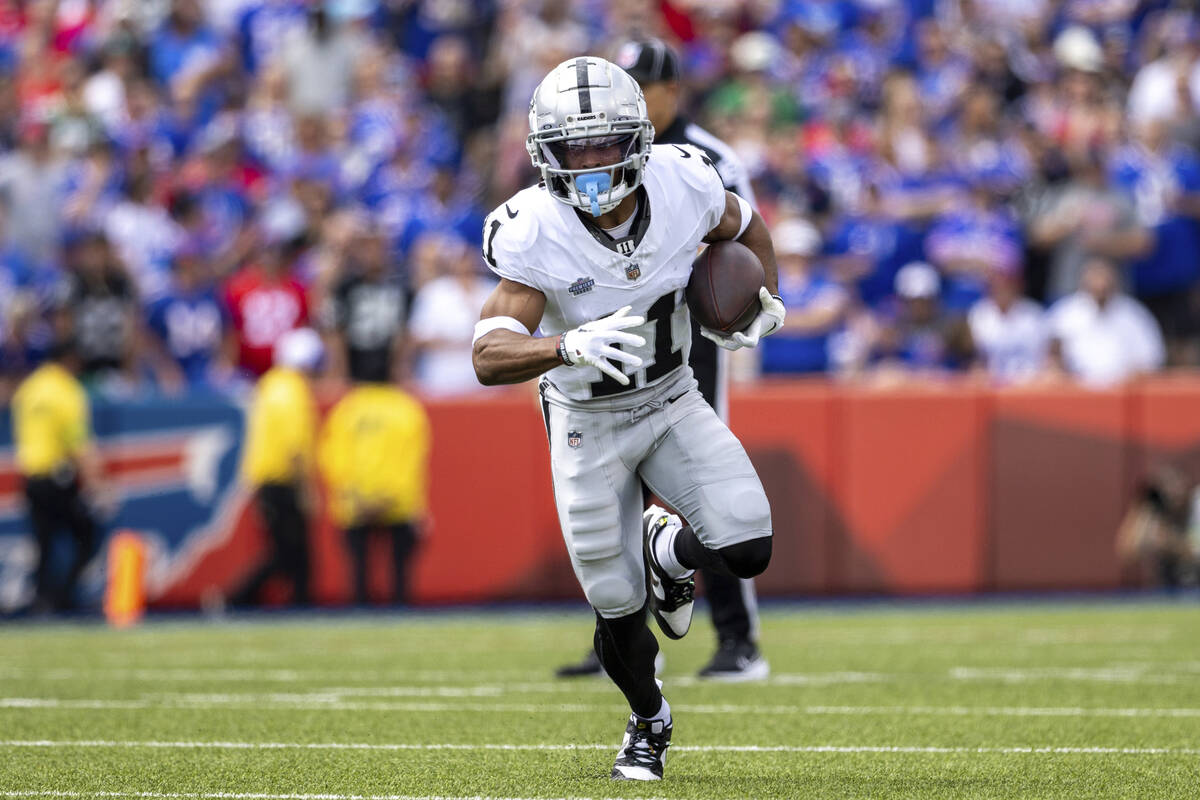 Las Vegas Raiders wide receiver Tre Tucker (11) runs after catch during an NFL football game, S ...