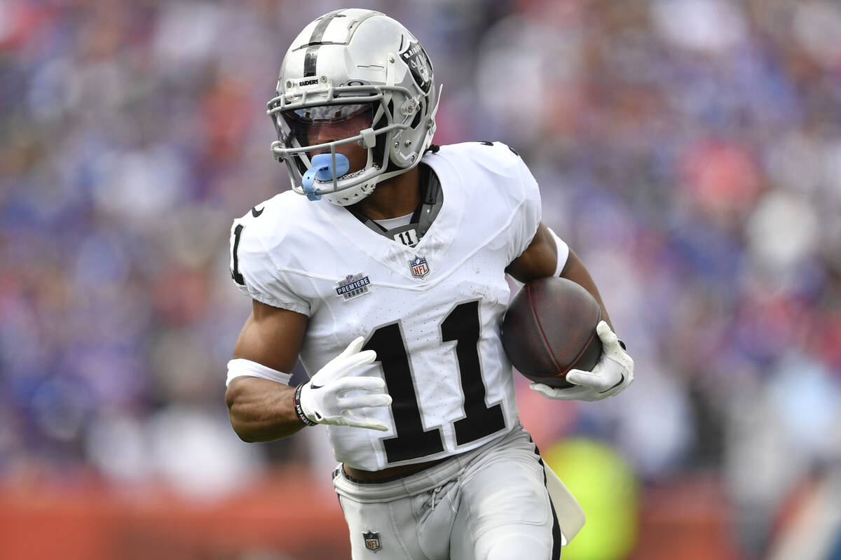 Las Vegas Raiders wide receiver Tre Tucker (11) runs during the first half of an NFL football g ...