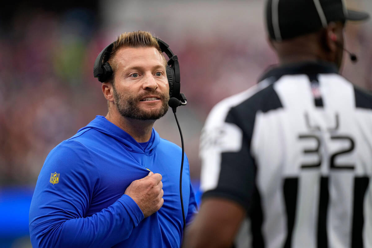 Los Angeles Rams head coach Sean McVay, left, talks to an official during the first half of an ...