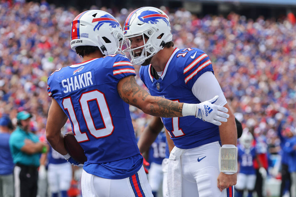 Buffalo Bills quarterback Josh Allen, right, celebrates with wide receiver Khalil Shakir (10) a ...