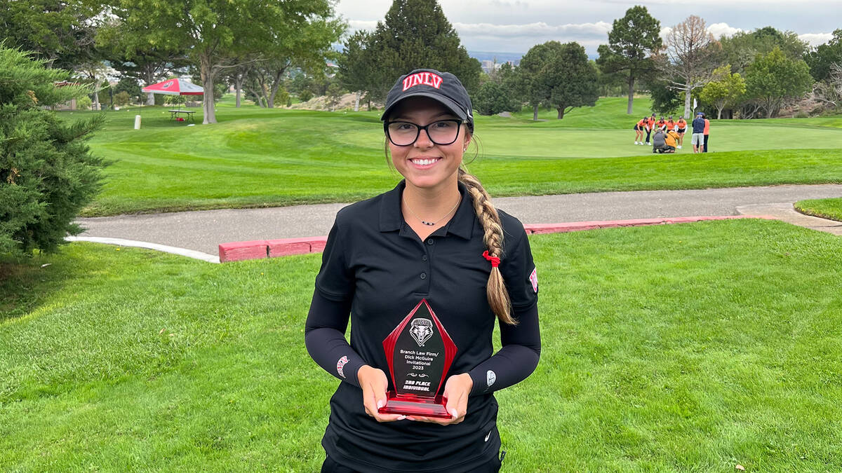 UNLV's McKenzi Hall holds her trophy after winning the 2023 Dick Maguire Invitational in Albuqu ...