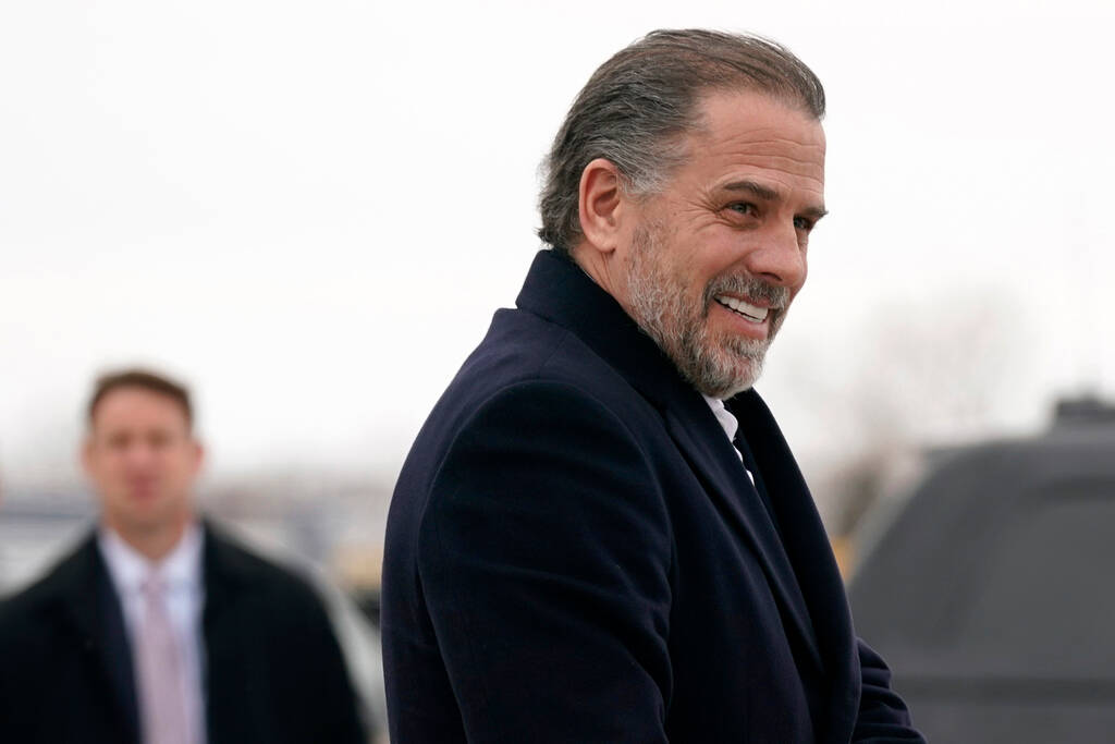 Hunter Biden, son of President Joe Biden, boards Air Force One with the president, Saturday, Fe ...