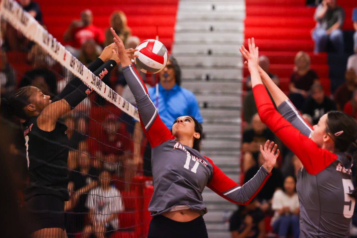 Arbor View’s Kenzy Arafa (17) attempts to block the ball after Liberty’s Kennedy ...