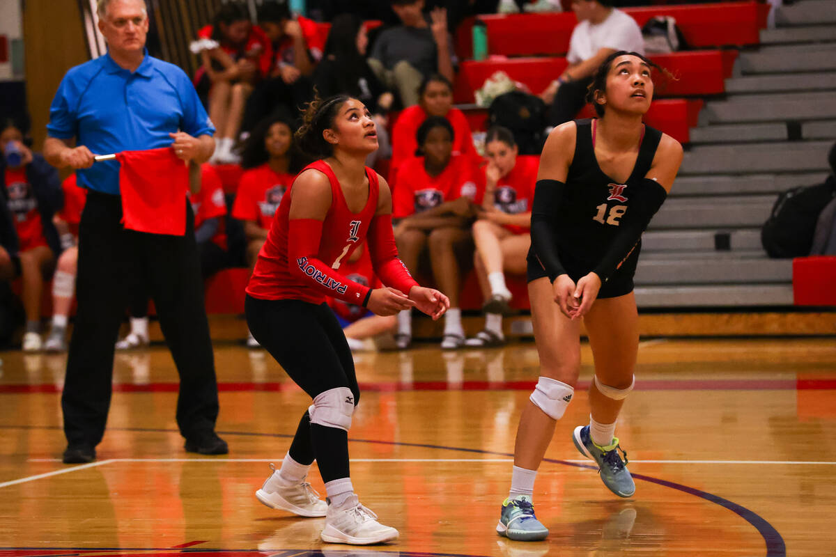 Liberty’s Tialofa Alofipo (1) and Tehani Moniz (18) prepare to bump the ball during a vo ...