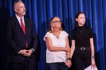Clark County District Attorney Steve Wolfson, left, stands with family members of Andreas Probs ...