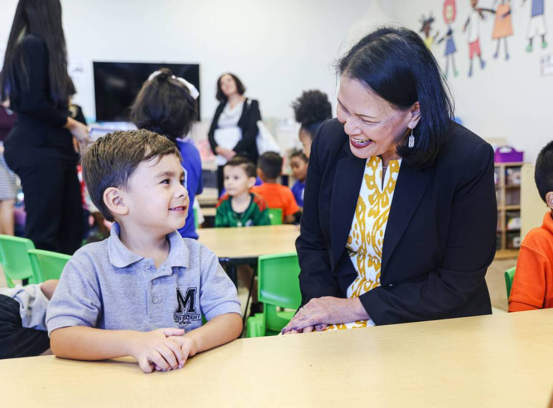 Julian Palomino, 4, left, speaks with Nevada Superintendent of Public Instruction Jhone Ebert, ...