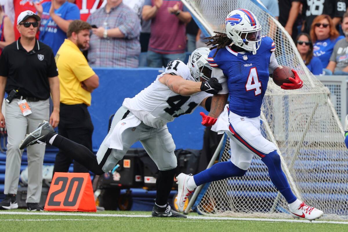 Las Vegas Raiders' Robert Spillane (41) forces Buffalo Bills' James Cook (4) out of bounds duri ...