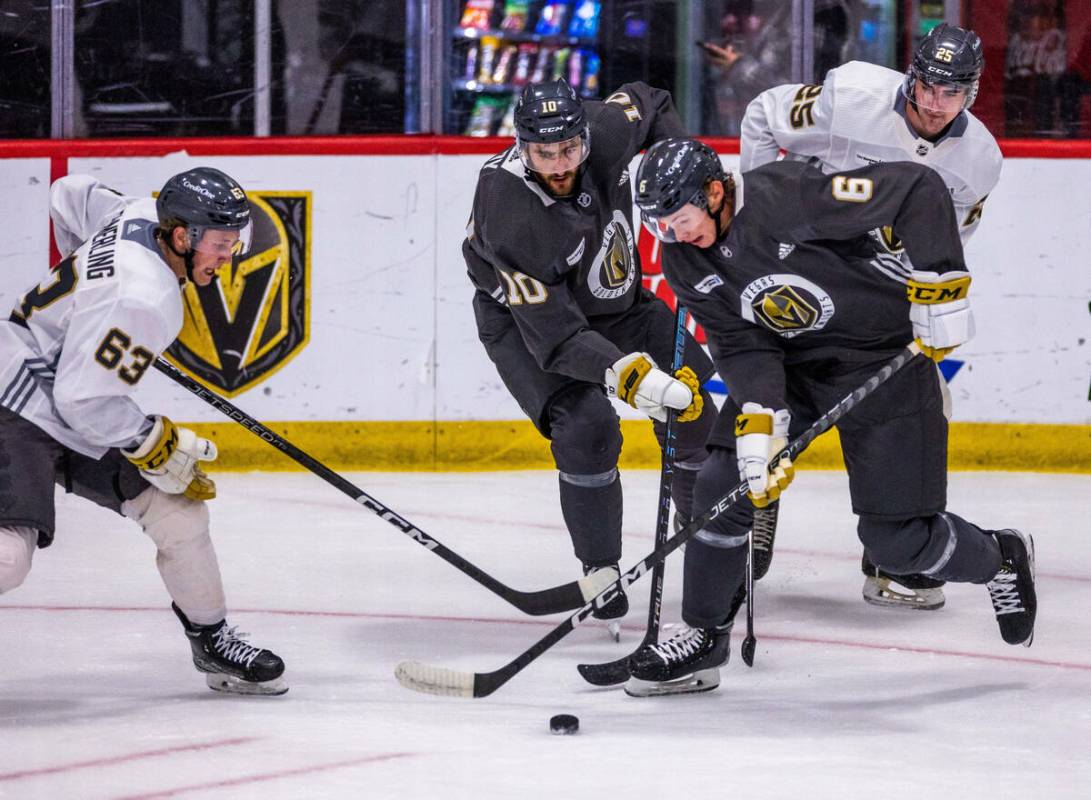 Golden Knights defenseman Kaedan Korczak (6) controls the puck away from center Nicolas Roy (10 ...