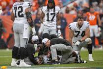 Raiders wide receiver Jakobi Meyers (16) remains down on the field and is looked at by trainers ...