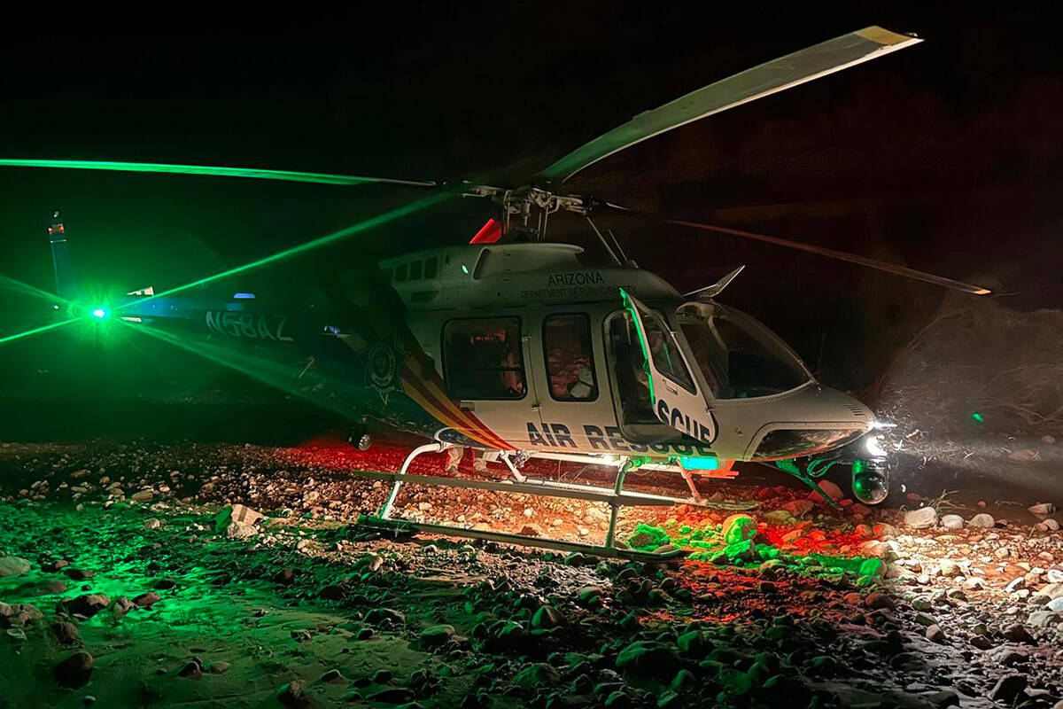 An Arizona Department of Public Safety Western Air Rescue helicopter lands near the Kanab Creek ...