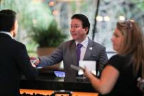 Guests check in to Aria Resort and Casino on Monday, Sept. 18, 2023, in Las Vegas. MGM Resorts ...
