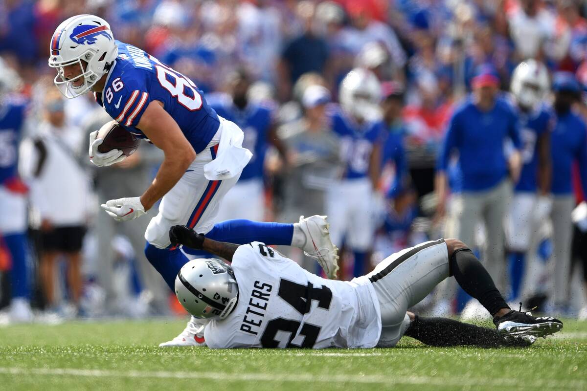 Buffalo Bills tight end Dalton Kincaid (86) breaks a tackle by Las Vegas Raiders' Marcus Peters ...