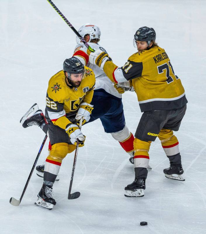 Golden Knights right wing Michael Amadio (22) gets around a pick by Florida Panthers center Eri ...