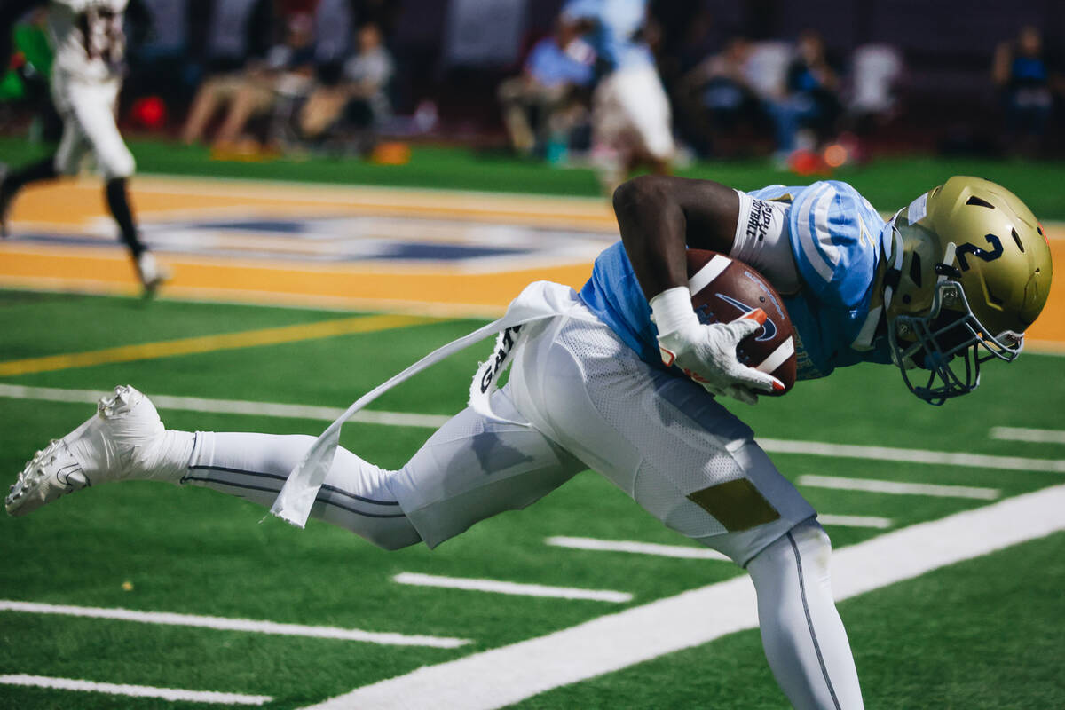 Foothill wide receiver Terrell Mack-Lovely runs out of bounds with the ball during a drive in a ...